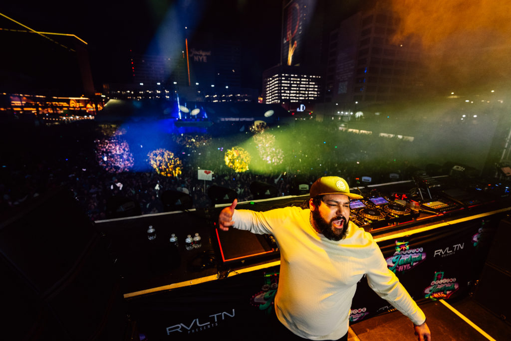 Deorro on stage in front of the crowd.
