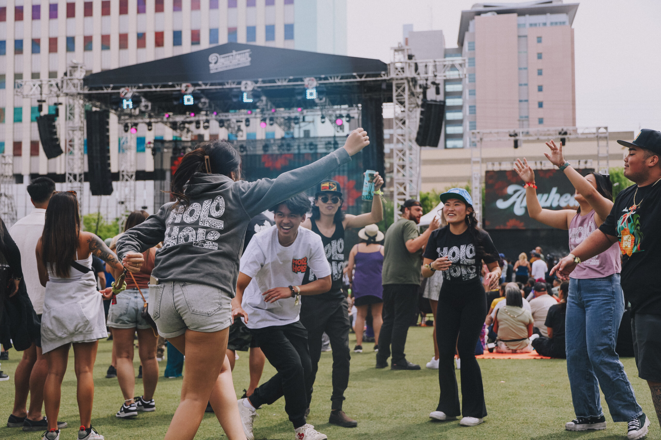 Guests dance in the crowd in front of the DLVEC stage.